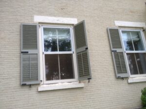 Rosslyn shutters loosened and flapping in the wind after July 19 thunderstorm.