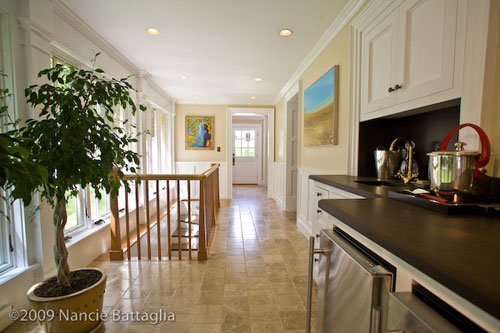 Rosslyn's bar and stairway to game room and wine cellar. (Credit: Nancie Battaglia)