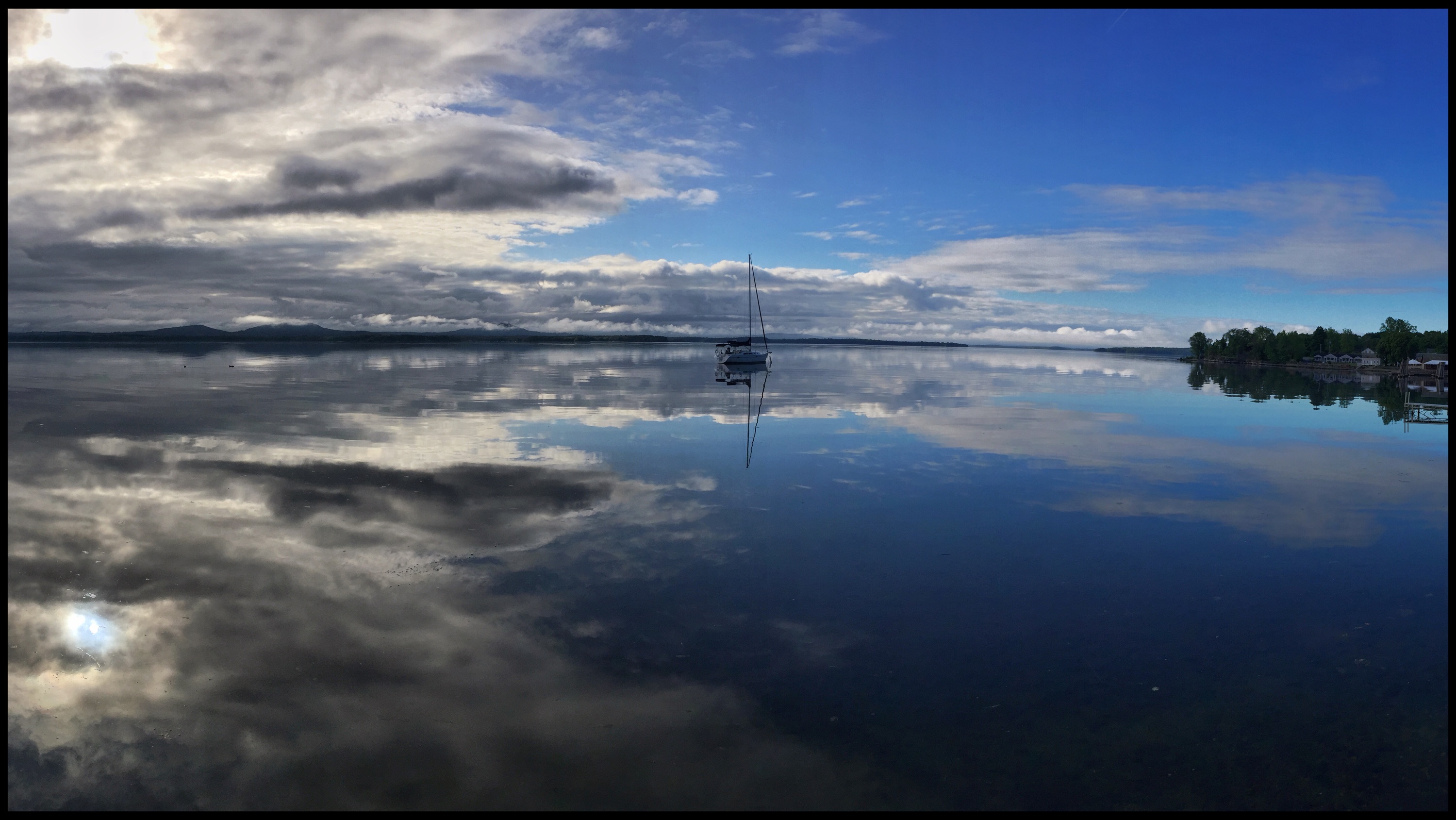 Lake Champlain offered up this morning mirror today. Errant reflected… (Source: Sailing Errant)