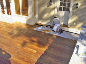 Wayne Gryk Sealing Garapa Deck, September 19, 2009 (Source: Geo Davis)