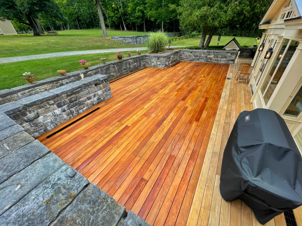 Oiling Garapa Decking: sealing progress is being made on the new deck, and the color/grain are popping dramatically. (Source: Eric Crowningshield)