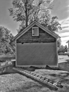 Removing Clapboard Siding from Icehouse (Source: Hroth Ottosen)