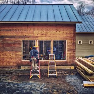 Icehouse Apertures and Transparency: Matt and Justin framing double hung windows. (Photo: Hroth Ottosen)