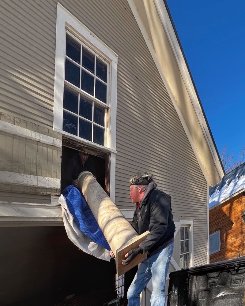 Hroth and Tony transporting repurposed columns from carriage barn hayloft to icehouse. (Photo: R.P. Murphy)