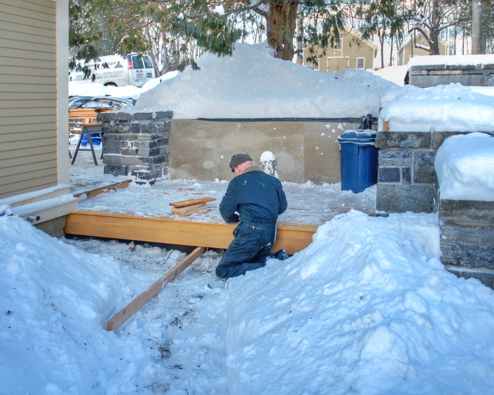 Warren Cross completing garapa decking installation on December 22, 2008 (Photo: Geo Davis)