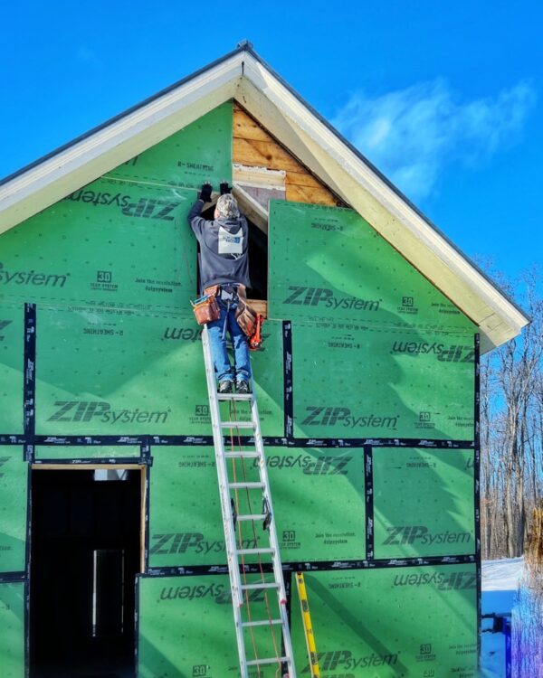 Hroth fitting final ZIP System panels on east elevation (Photo: R.P. Murphy)