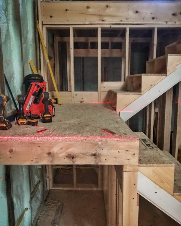 Mid-story landing 100% level for new stair framing. (Photo: Hroth Ottosen)