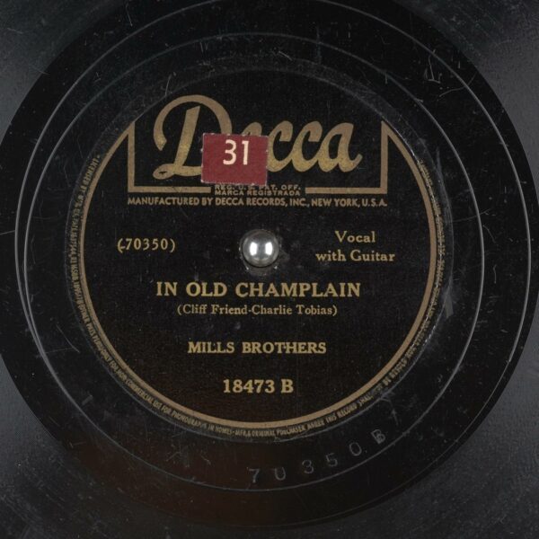 "In Old Champlain", released in 1942 by Decca Records, performed by Mills Brothers, and music/lyrics by Cliff Friend and Charlie Tobias