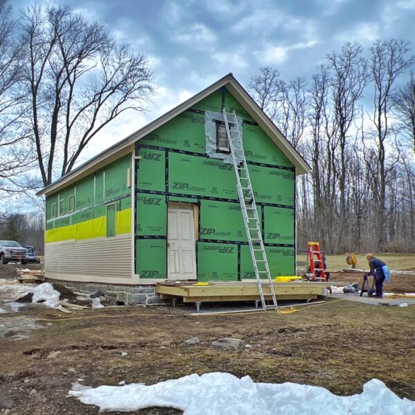 Tony Installing Clapboard on Icehouse (Photo: R.P. Murphy)