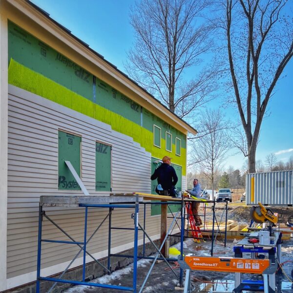 Calvin and Tony Install Clapboard on Icehouse, North Elevation (Photo: R.P. Murphy)