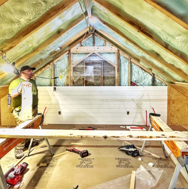 Installing tongue and groove nickel gap in the icehouse loft (Photo: Geo Davis)