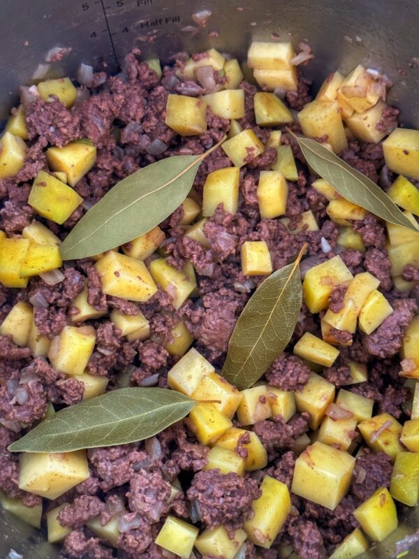 Add Bay Leaves to Elk Green Chile Stew (Photo: Geo Davis)