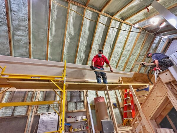 Supi and Matt Installing Nickel Gap on Icehouse Ceiling (Photo: Geo Davis)