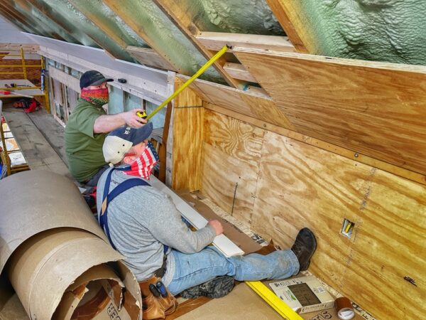 Matt and Jarrett Installing Nickel Gap on Icehouse Ceiling (Photo: Geo Davis)