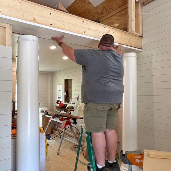 Justin Installing Column​s (Photo: Geo Davis)