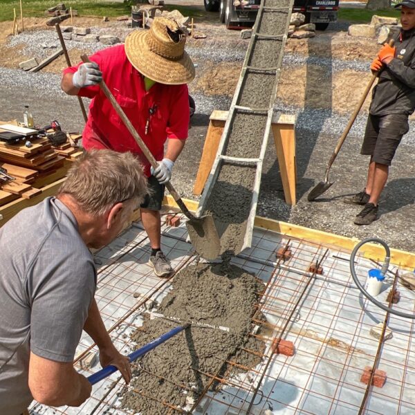 Supi and Calvin Pull Concrete for Hot Tub Slab (Photo: R.P. Murphy)