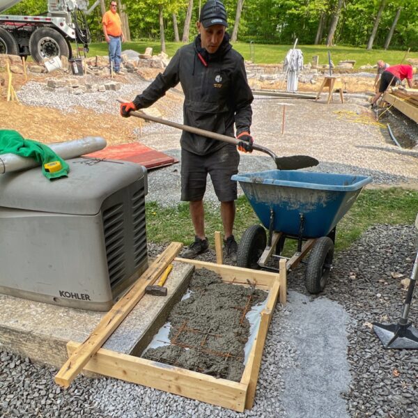 Tony Fills Concrete form for Mini Split Slab (Photo: R.P. Murphy)