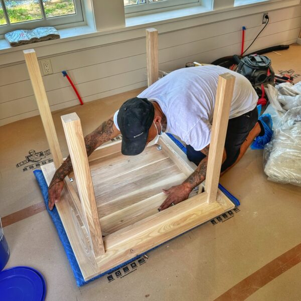 Tony Sanding Underside of Ash & Elm Table (Photo: Geo Davis)