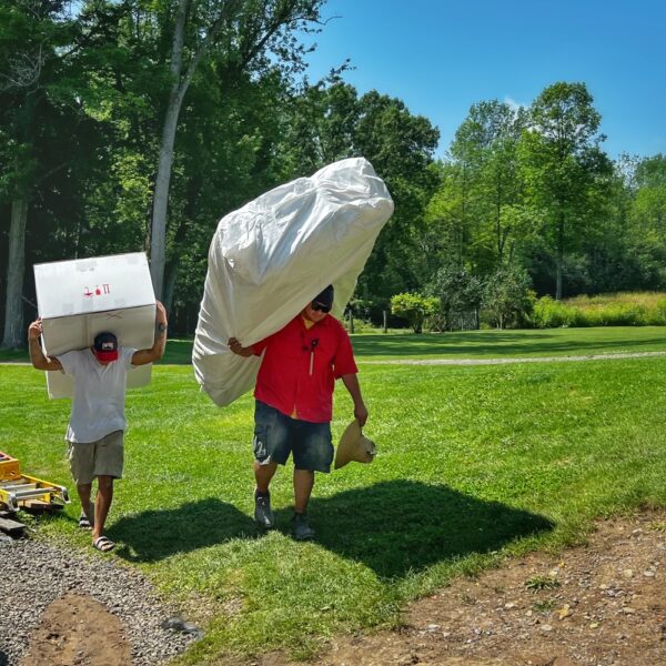 Move In Begins​: Tony and Supi Carrying furniture to the icehouse (Photo: R.P. Murphy)