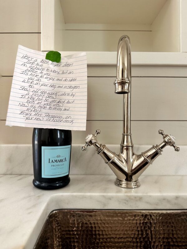 Pam’s poem with a bottle of bubbly (Photo: Geo Davis)