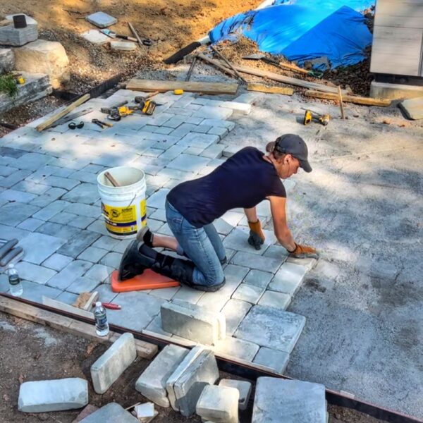 Pam Solving the Paver Puzzle (Photo: Tony Foster)