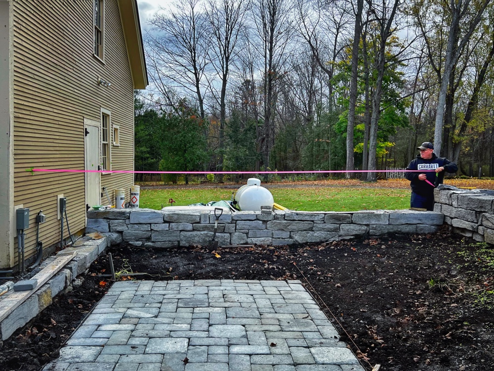 Enclosure: Steve Cooley improving fence height (Photo: R.P. Murphy)