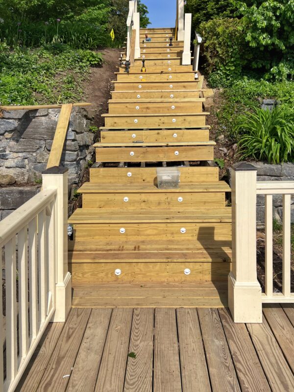 Installing Posts and Railings for Lakeside Staircase (Photo: Tony Foster)